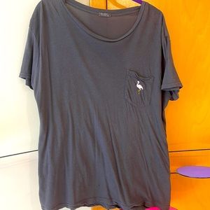 Cute brandy melville t-shirt with flamingo pocket detailing